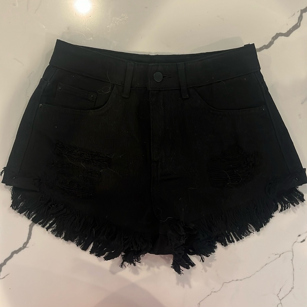 Sheen, black jeans, stretchy shorts with distressed fronts